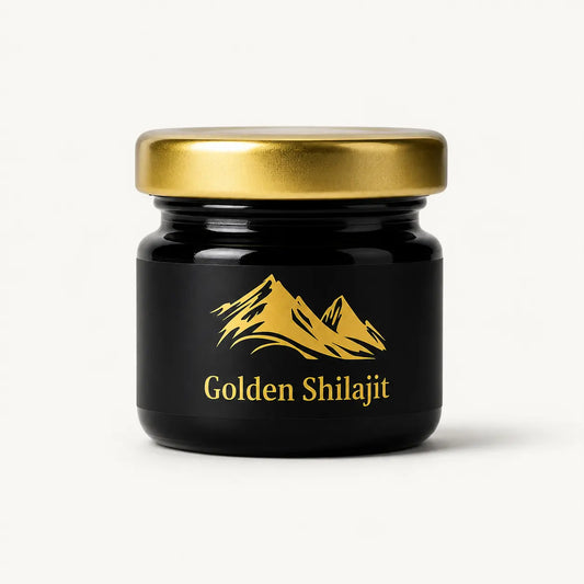 A small black glass jar with a metallic gold lid and a gold label featuring a mountain graphic and the text 'Golden Shilajit' on a clean white background.