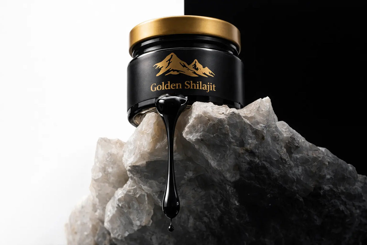 Jar of Golden Shilajit with shilajit oozing out onto a rock