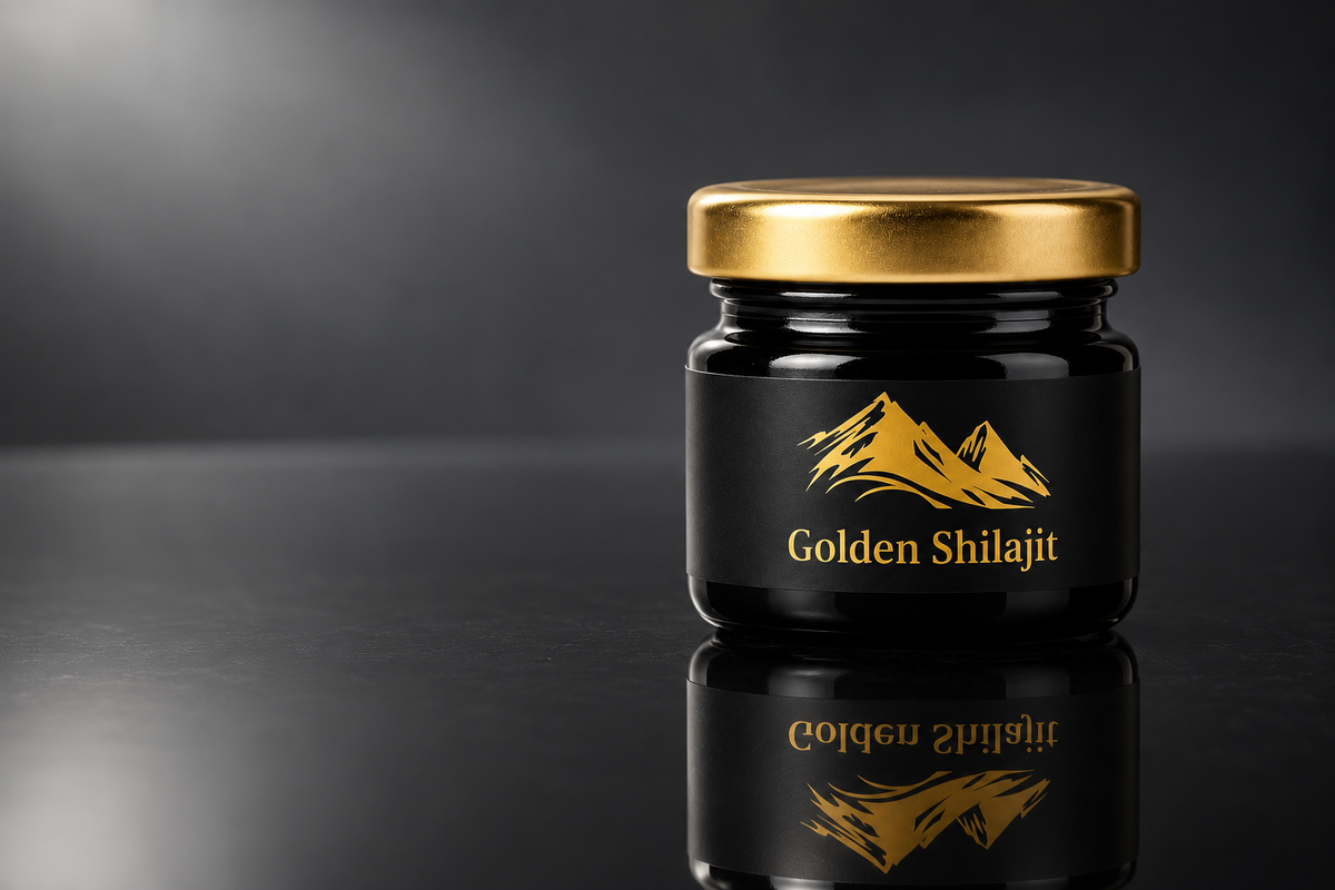 Golden Shilajit Resin jar with gold lid on a dark reflective surface