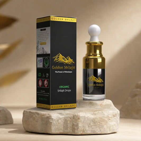 Golden Shilajit bottle and packaging on a stone surface with a neutral background